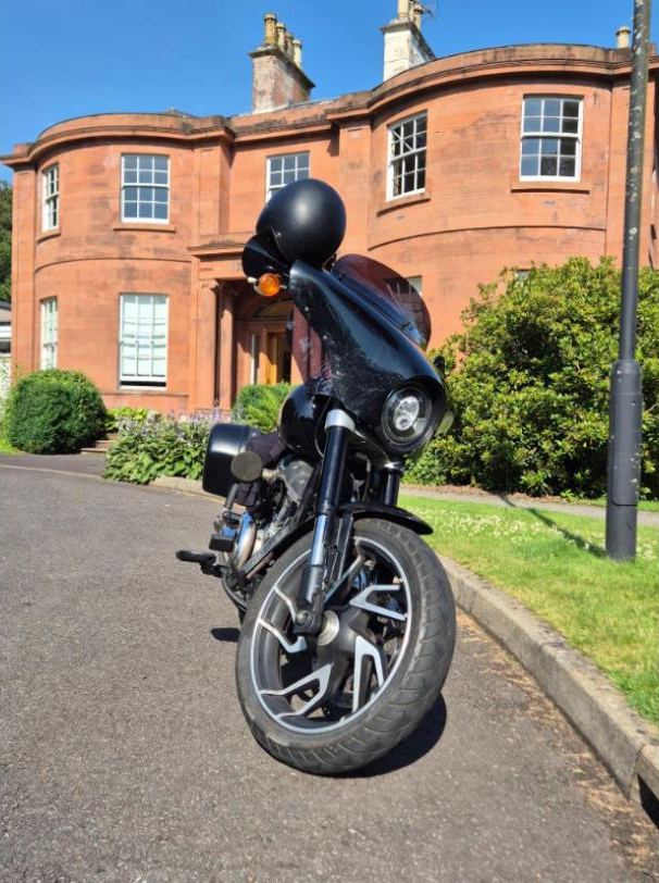 The bike outside Woodland House Hotel