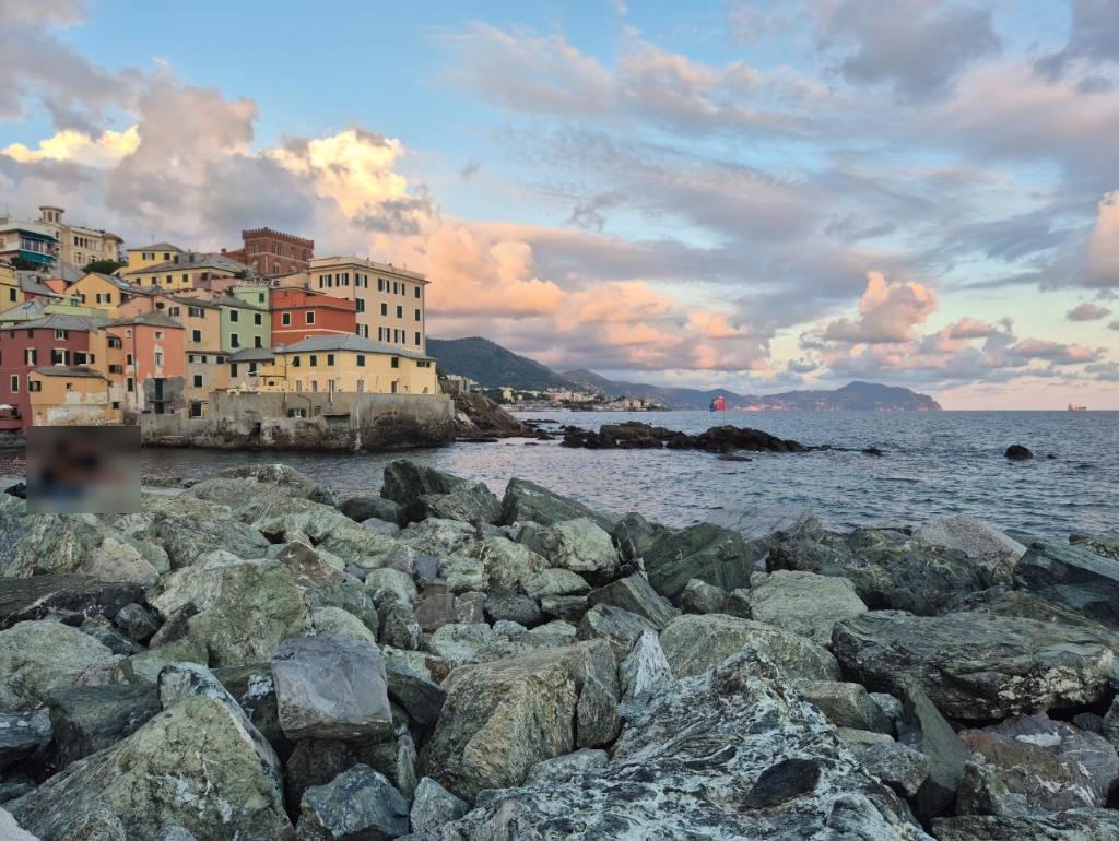 Coloured houses over the rocks at sunset