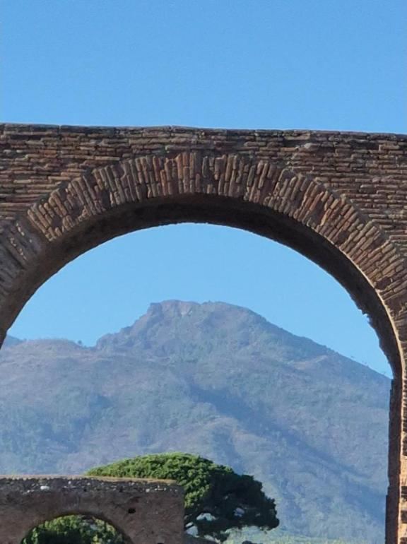 Vesuvius through an old arch