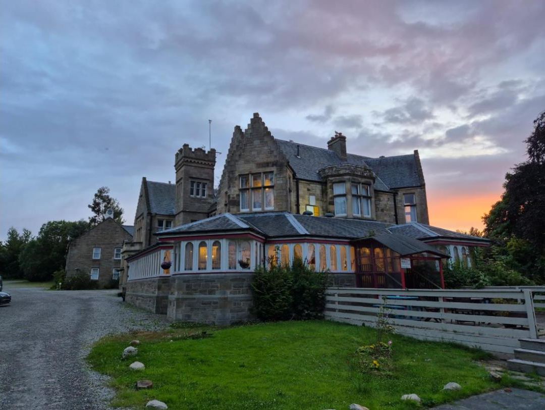 Old stone hotel at sunset