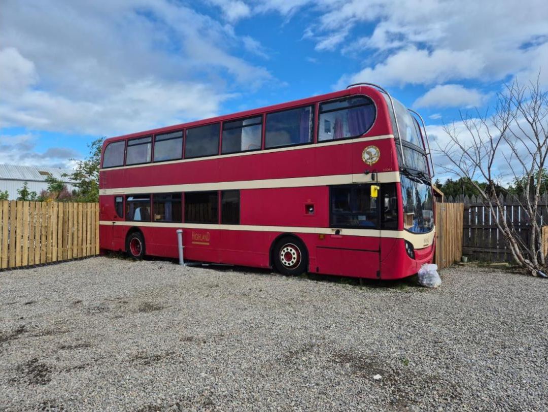 The red double-decker at the glamping site