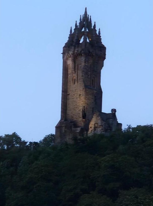 The Wallace Monument lit up at dusk