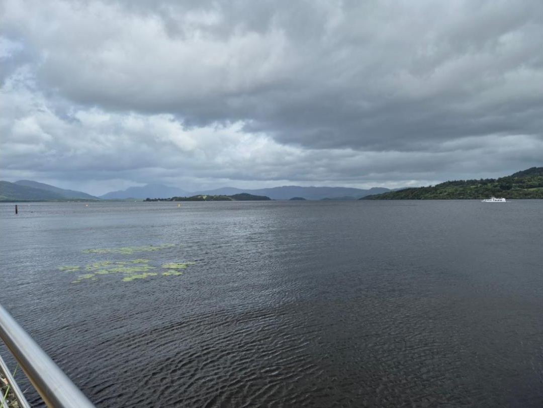Grey sky over the loch and the hills