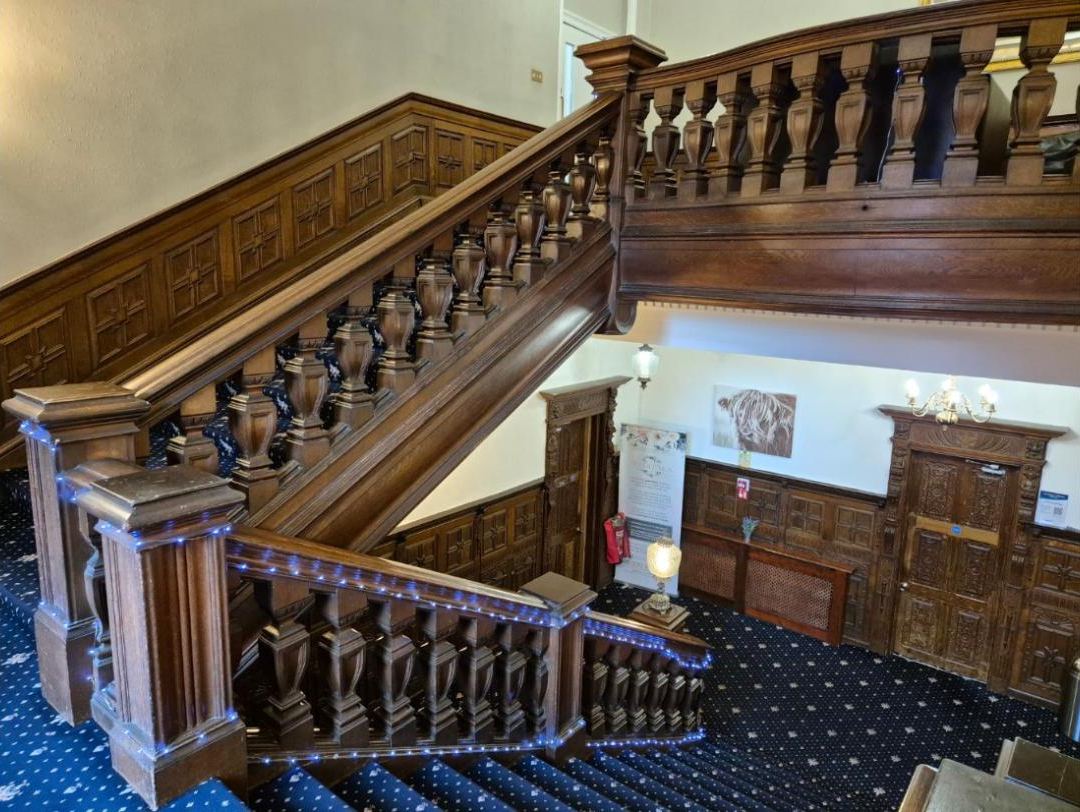 Carved wooden stairs in the hall